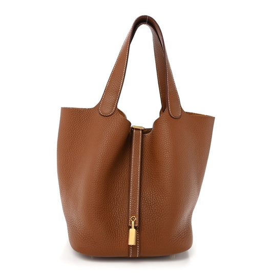 Brown leather tote bag with two top handles and central vertical gold-tone lock.