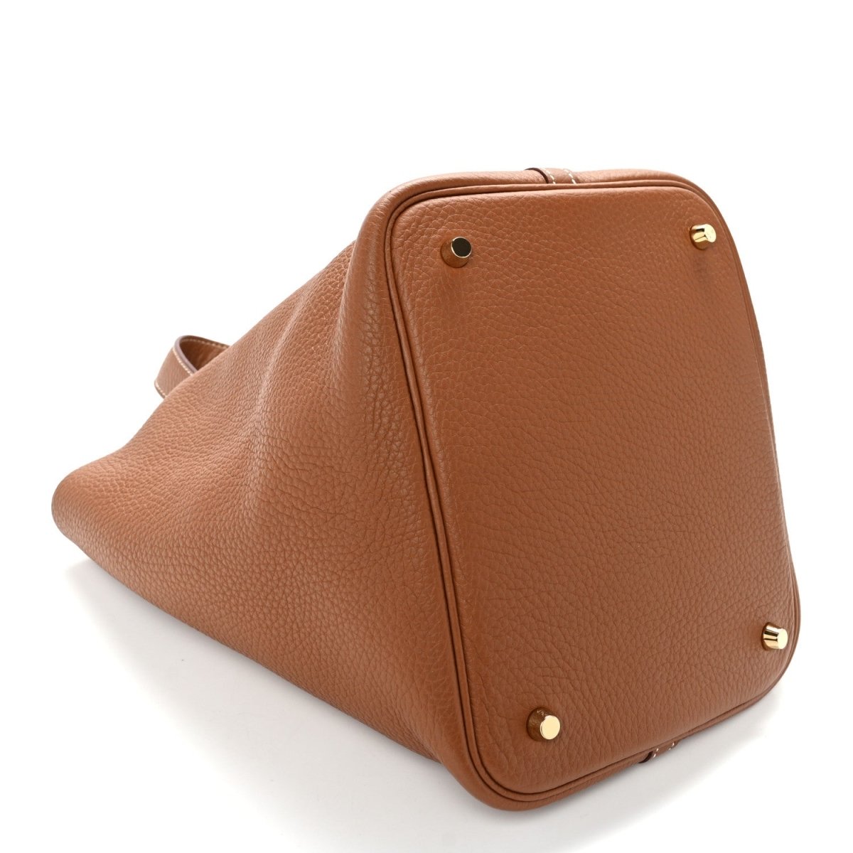 Brown leather handbag with top flap closure and gold-tone corner details.