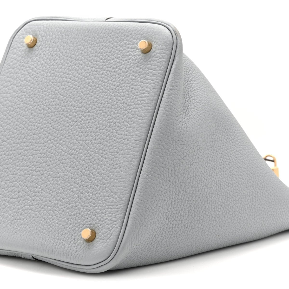 Gris leather tote bag corner view with pebbled grain and gold studs