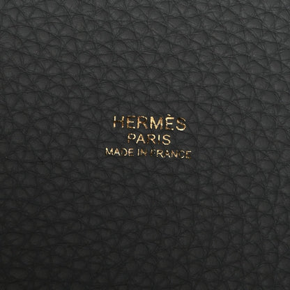 Black leather stamp reading “HERMÈS PARIS MADE IN FRANCE”