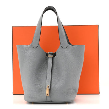 Gris pebbled leather tote bag with top handles and central lock clasp