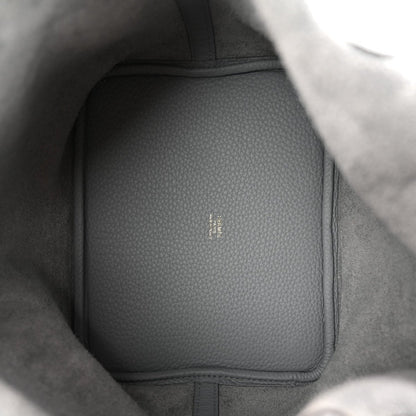 Gris leather bag interior panel with pebbled texture and stitched edge