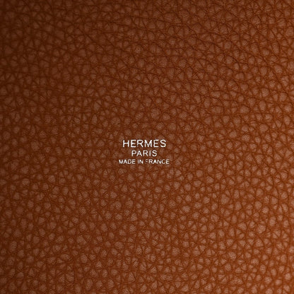 HERMES PARIS made in France embossed on brown leather tote surface