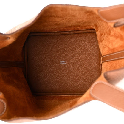 Leather tote bag interior with brown lining and zip pocket