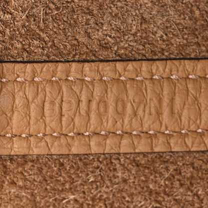 Leather edge trim with white edge stitching and textured lining