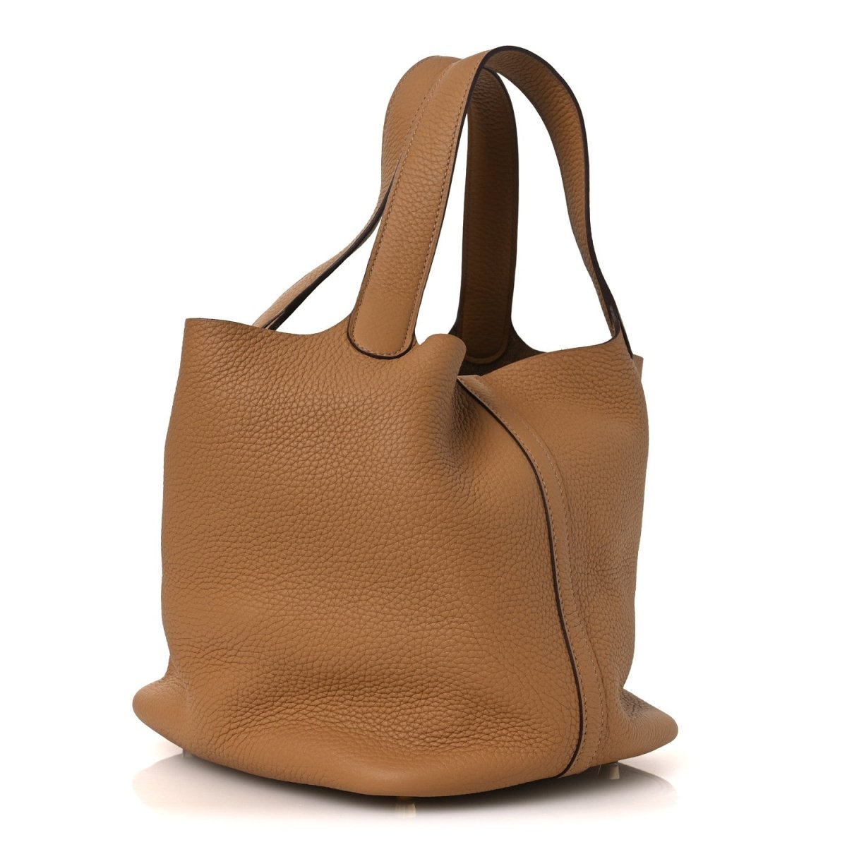 Pebbled leather tote bag with wide handles and curved side panel, biscuit.