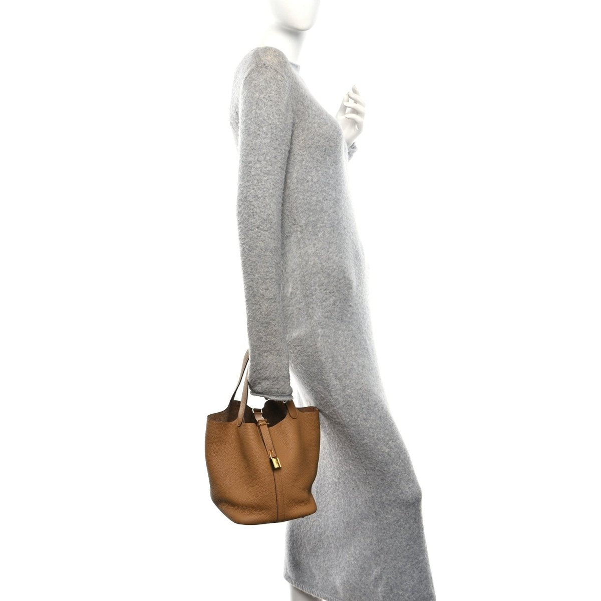 Small pebbled leather tote bag with top handles and gold lock clasp, biscuit.