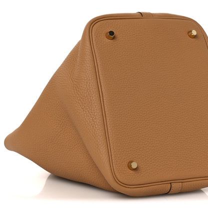 Leather tote with front snap detail and pebble-grain surface