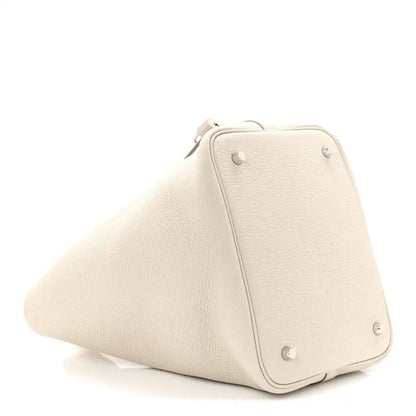 Off-white leather bucket bag with top handle and front lock strap detail