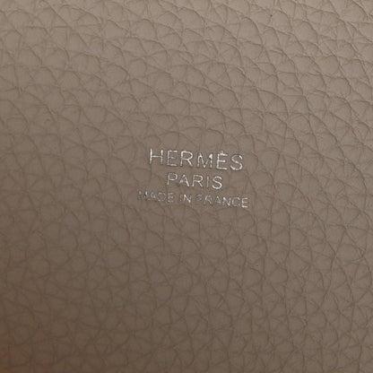 Off-white leather bag base with embossed brand text HERMES PARIS