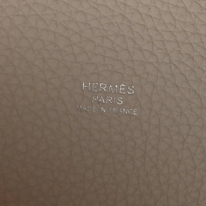 Off-white leather bag base with embossed brand text HERMES PARIS