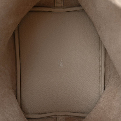 Off-white leather bucket bag interior with smooth lining and molded side walls