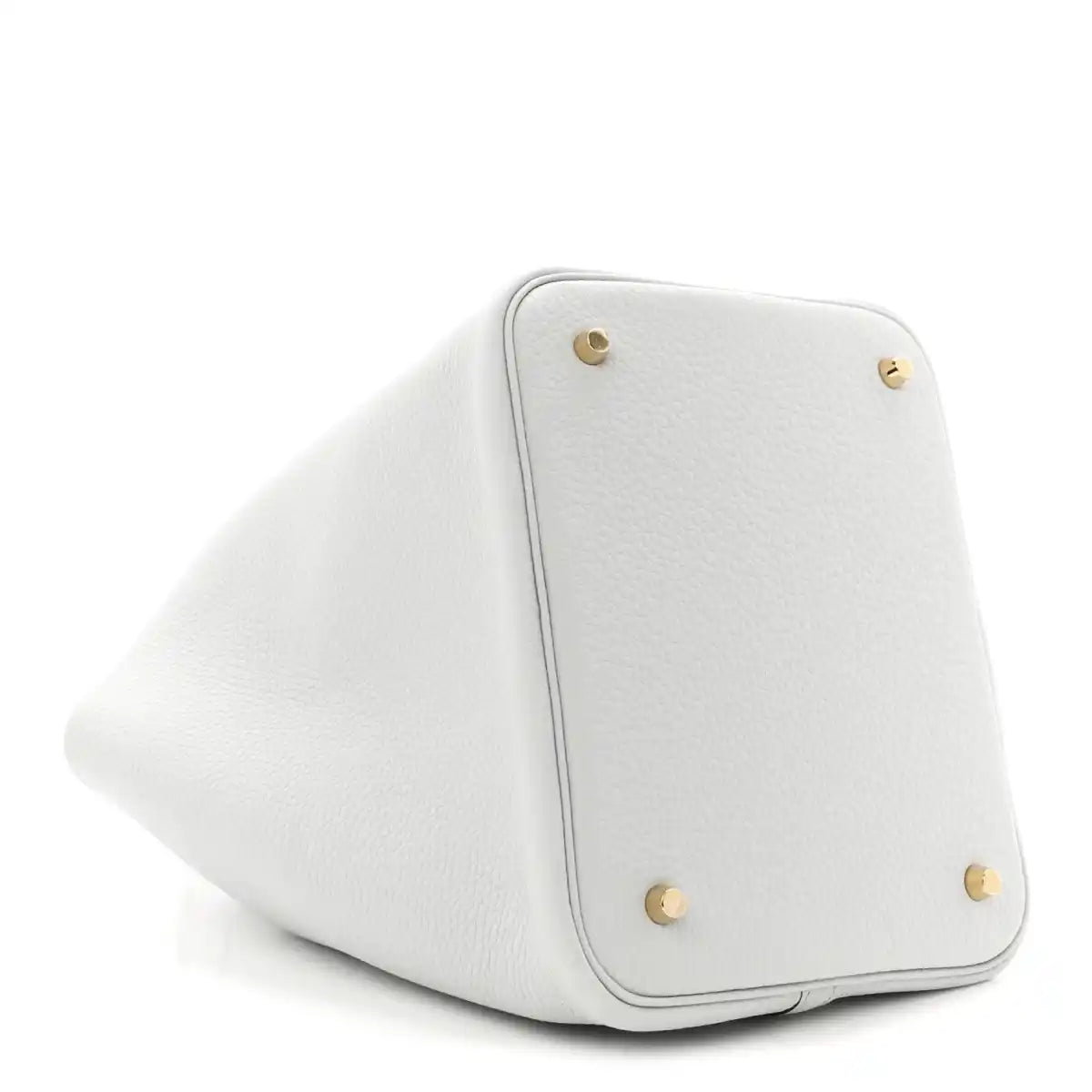 Light blue leather bucket tote corner with snap buttons and curved edge