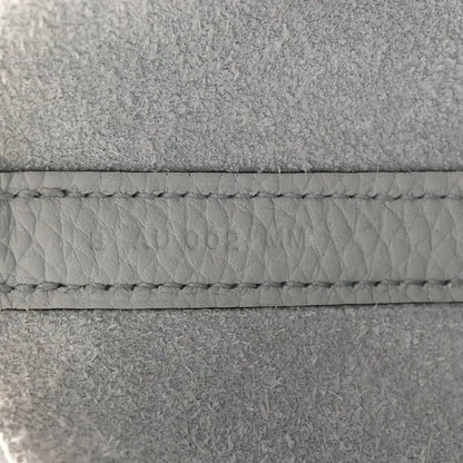 Light blue leather tote stitching detail along the seam and edge