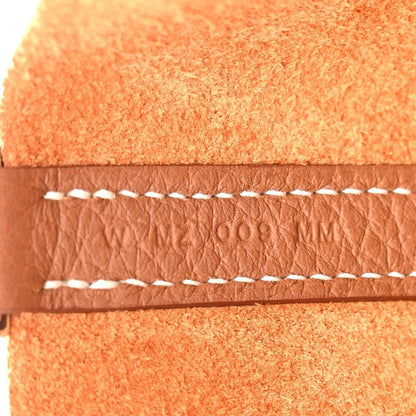 Tan leather edge with white braided stitching detail