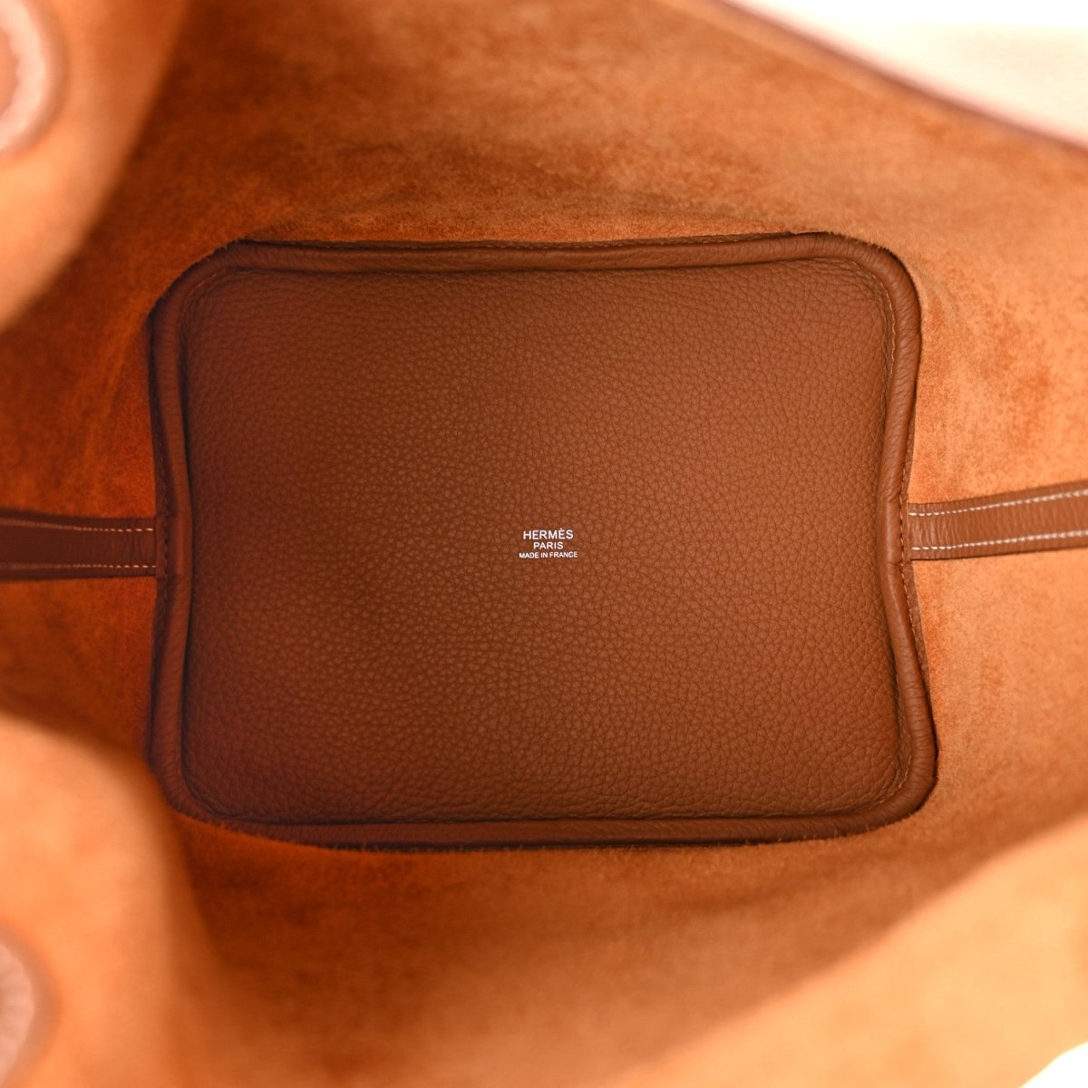 Tan leather interior pocket with HERMÈS logo patch