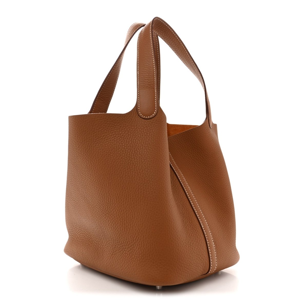 Tan leather bucket tote bag with wide handles and side seam