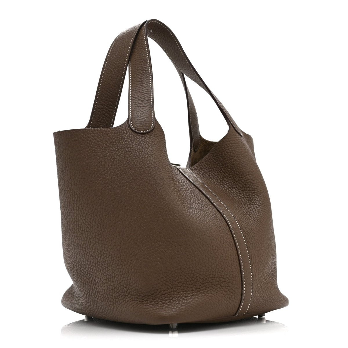 Taupe leather tote bag with curved silhouette, side seam, and top handles