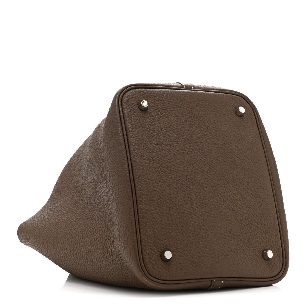 Taupe leather tote bag top panel with four metal studs and curved frame