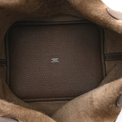 Taupe leather tote bag interior with brand label stamp on lining
