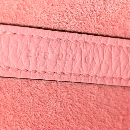 Rose leather edge with stitched trim and recessed embossing detail