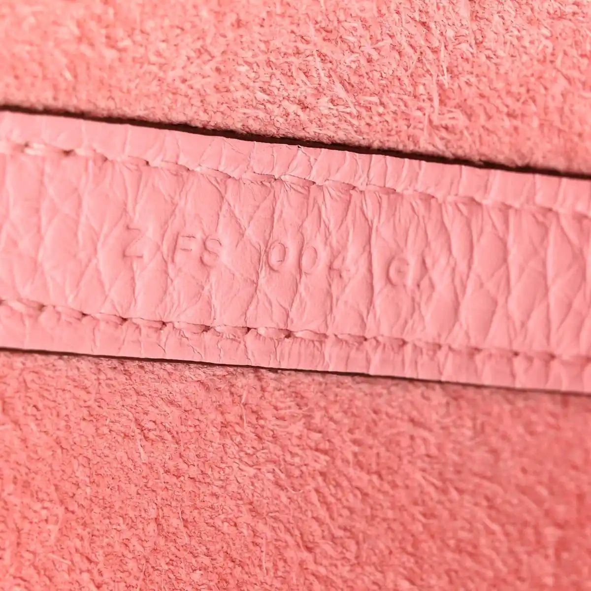 Rose leather edge with stitched trim and recessed embossing detail