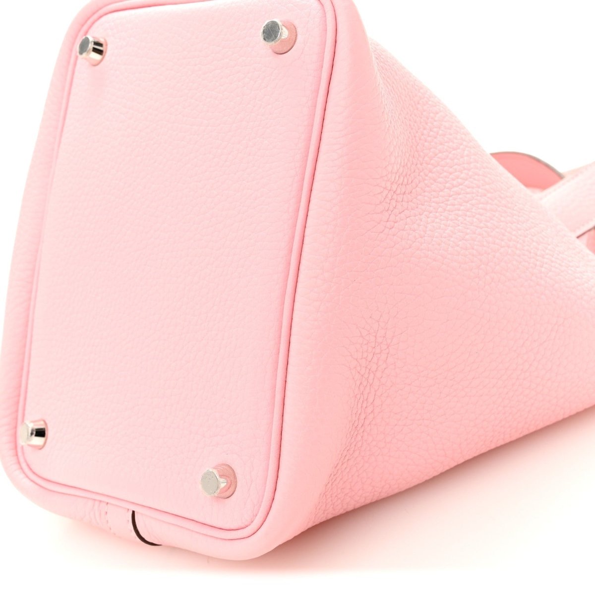 Rose pink leather bucket bag side with metal eyelets and stitched panel