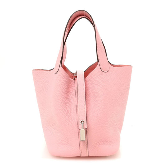 Rose pink leather bucket bag with top handles and central lock clasp