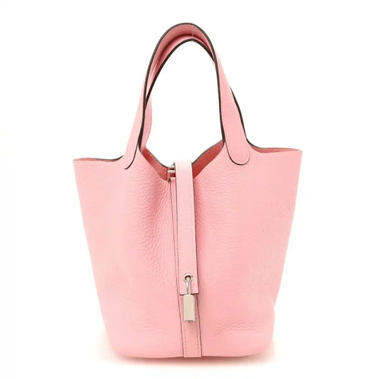Rose pink leather bucket bag with top handles and central lock clasp