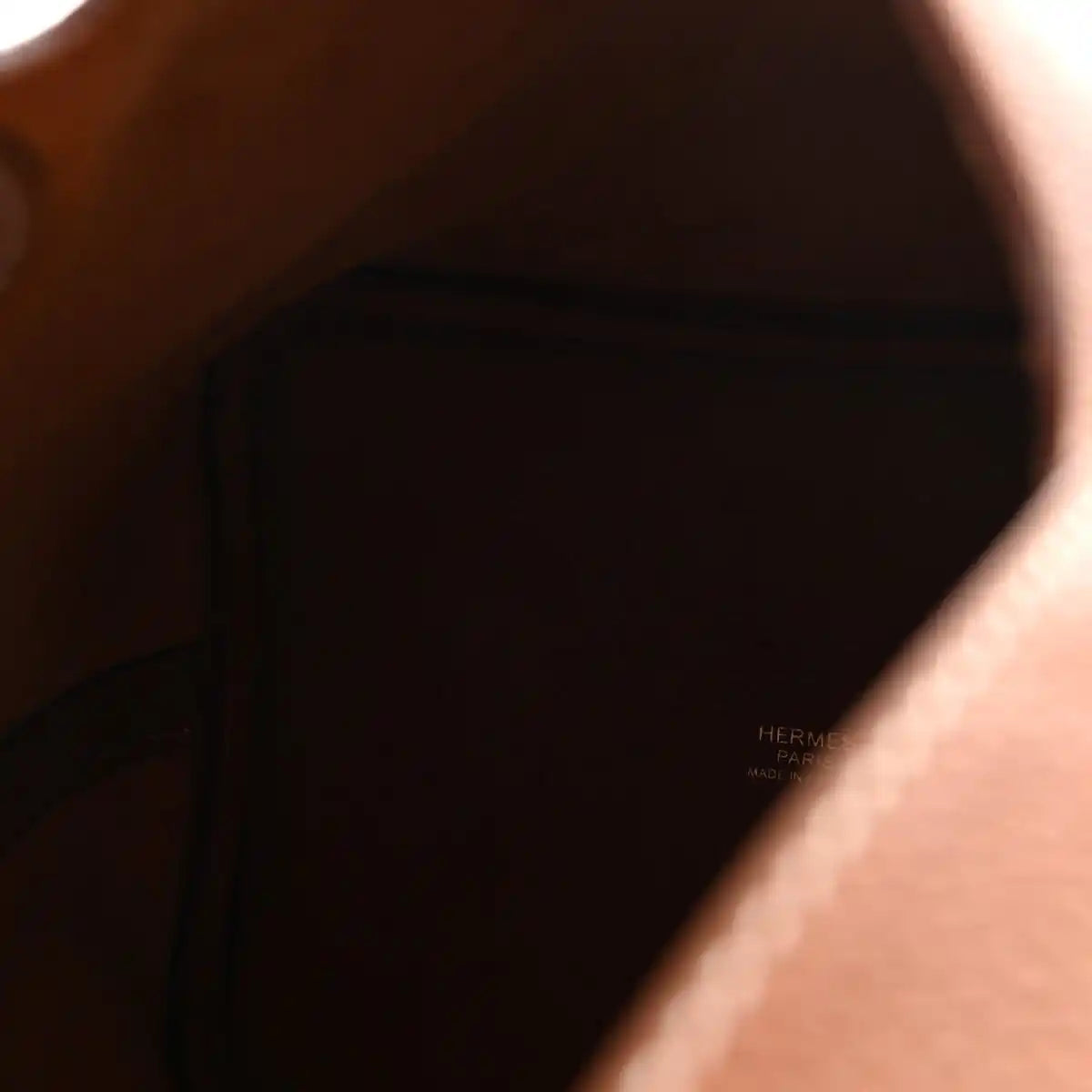 Leather handbag interior lining with embossed HERMES PARIS and Made in France text
