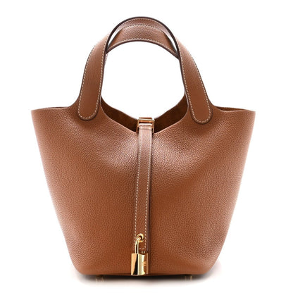 Brown leather Picotin-style handbag with top handles and gold lock hardware