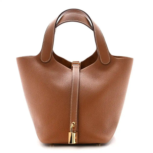 Brown leather Picotin-style handbag with top handles and gold lock hardware