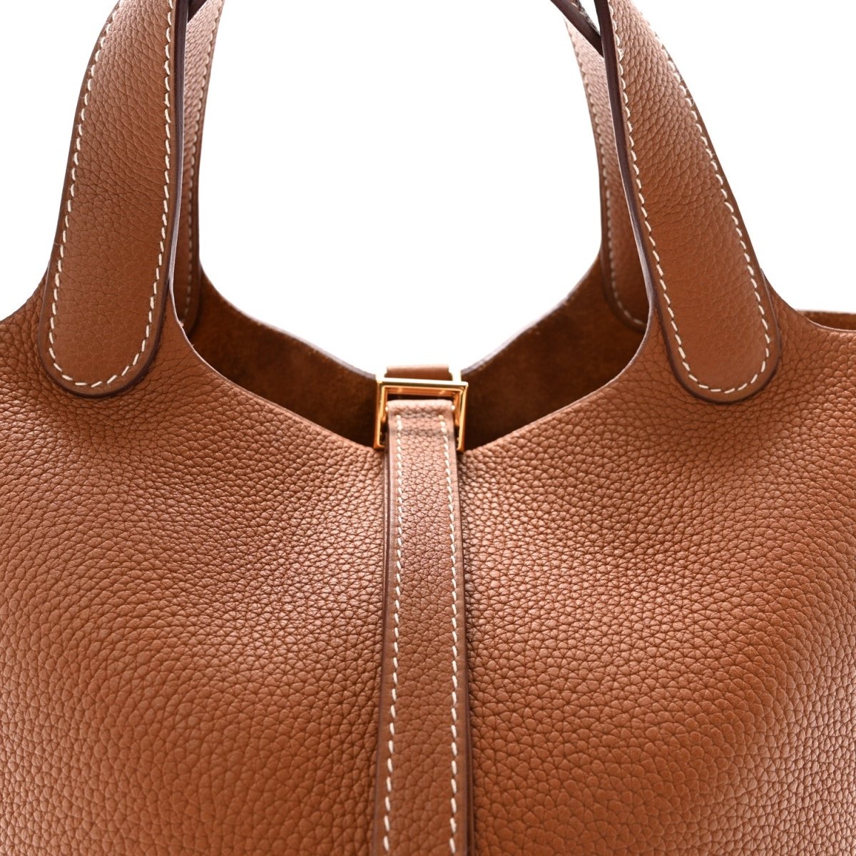 Brown leather handbag front with top handles and gold lock zipper detail