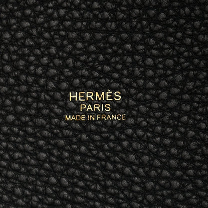 Black leather tote panel with embossed “HERMES PARIS MADE IN FRANCE” text.