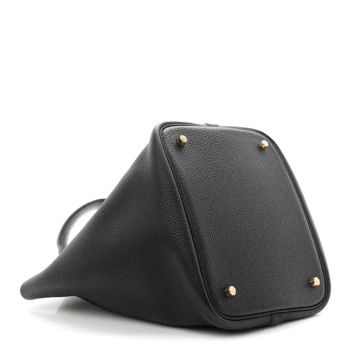 Black leather tote with gold-tone studs and triangular profile on angled view.