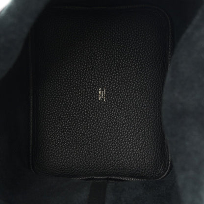 Black leather tote, textured grain with central stamped branding.