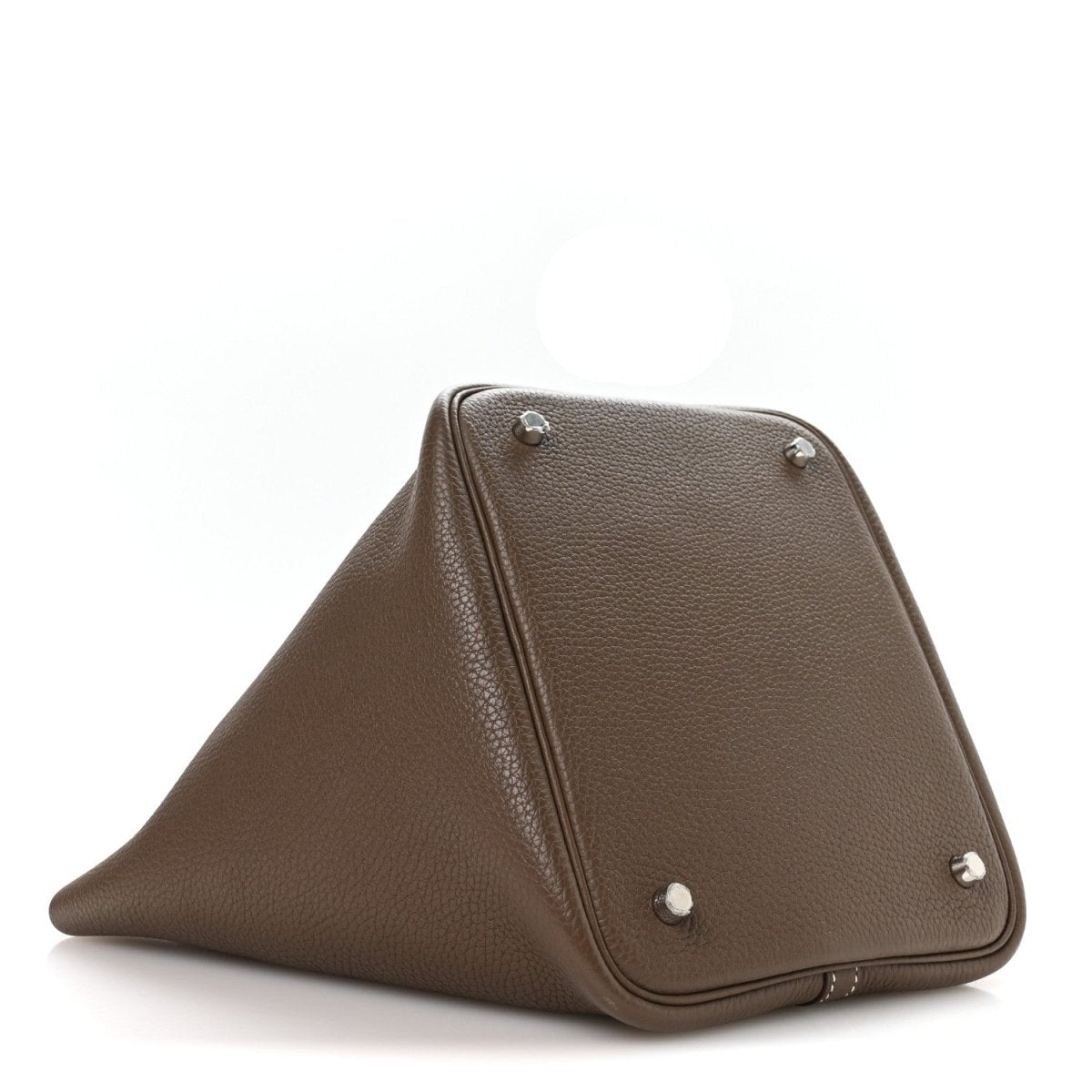 Taupe leather handbag with fold-over top and metal corner feet