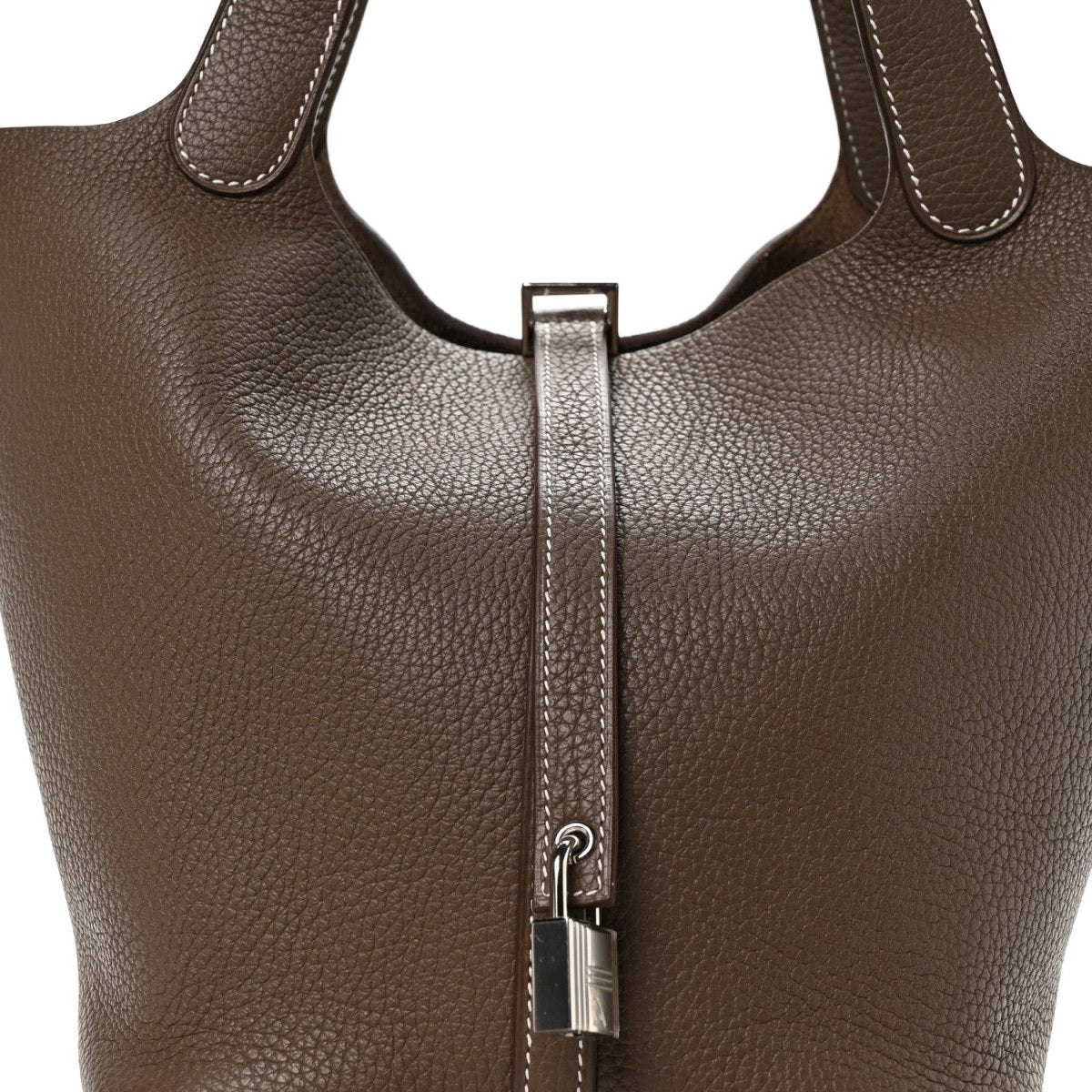 Taupe leather handbag with central lock and top handles, textured finish