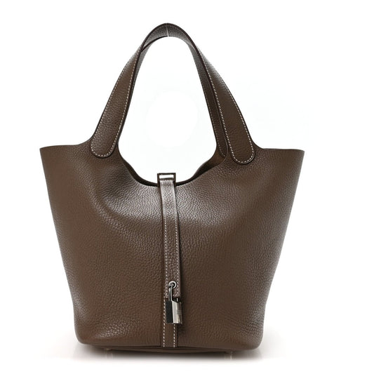 Taupe leather tote handbag with central lock and double top handles