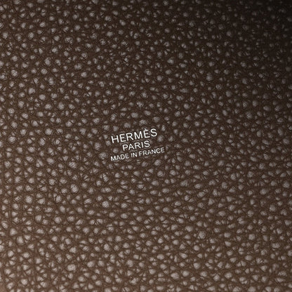 Hermès Paris stamp and Made in France on taupe textured leather lining