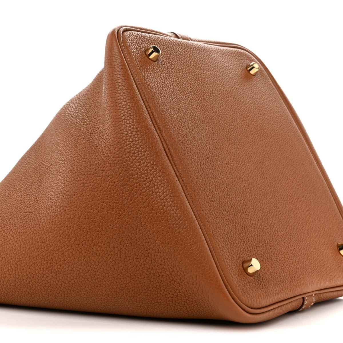 Tan leather Picotin-style tote bag with gold hardware and top corner studs