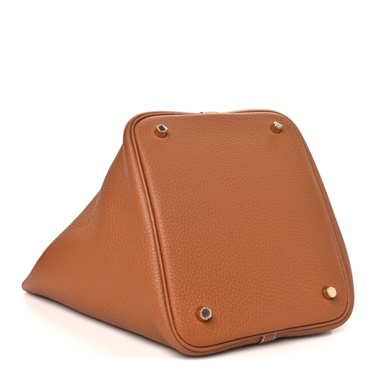 Leather tote bag with triangular fold shape, top corner metal studs, tan/brown.