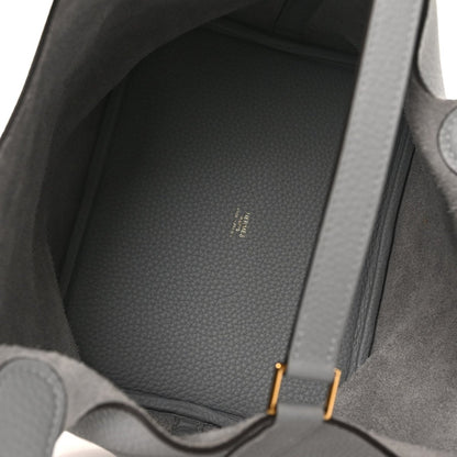 Grey leather tote interior with textured lining and visible stitching