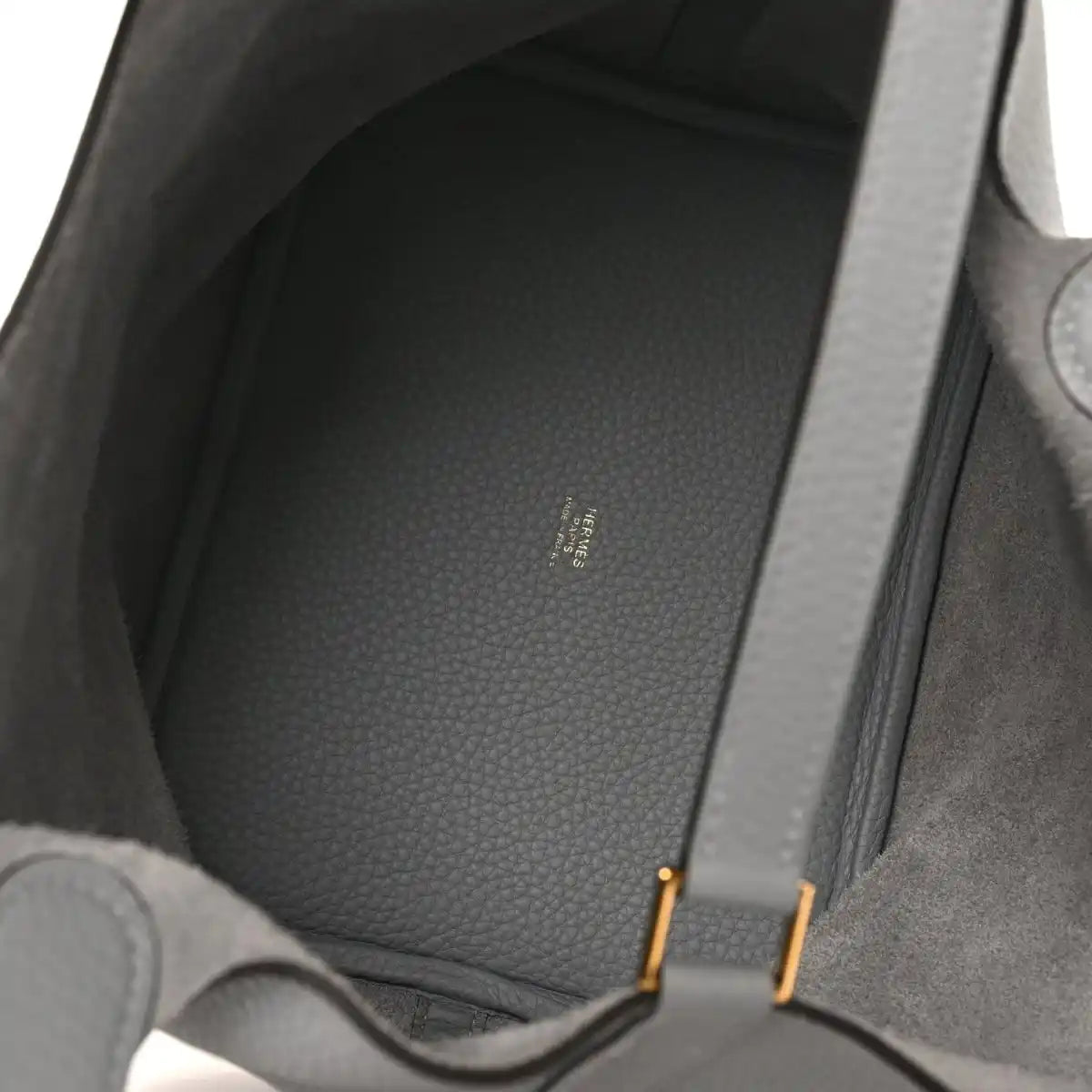 Grey leather tote interior with textured lining and visible stitching