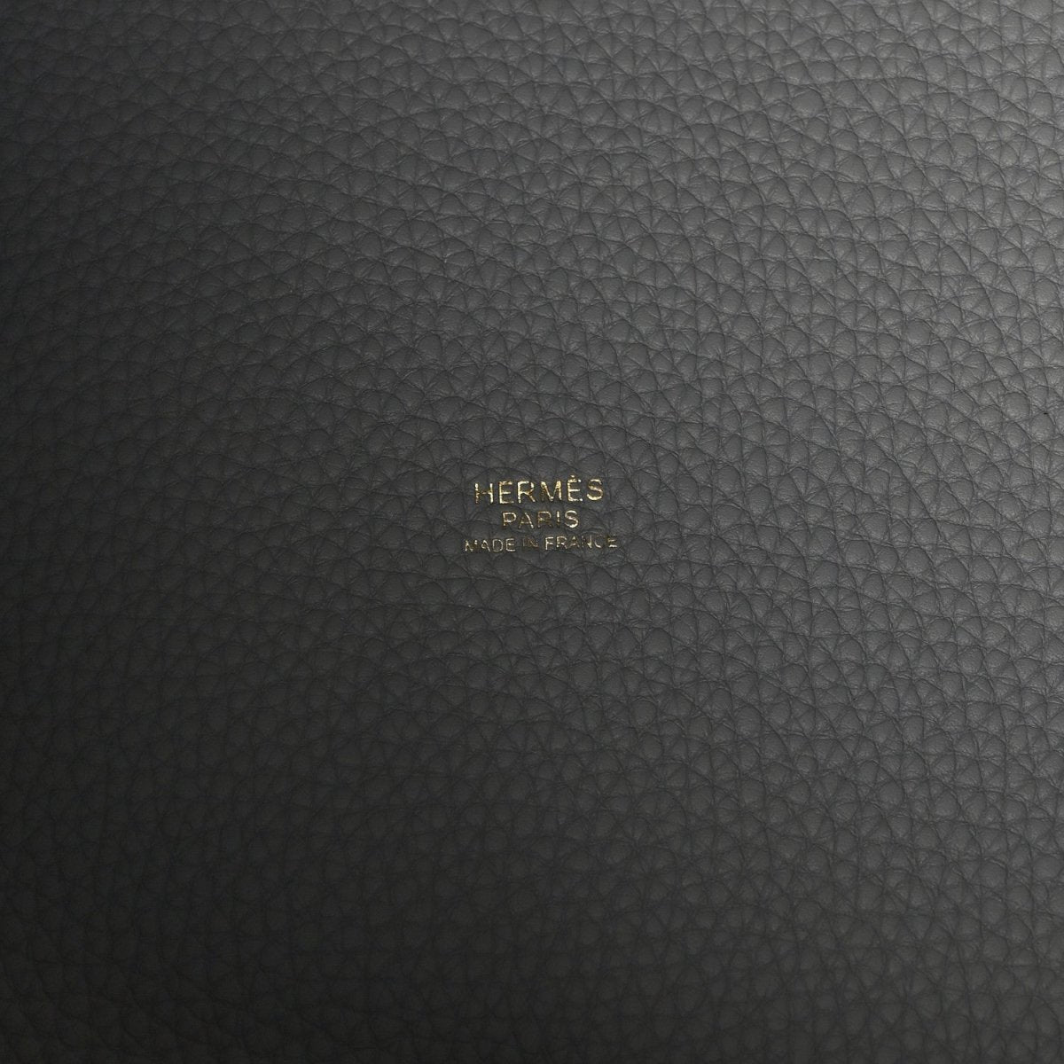 Hermès Paris stamped on dark grey leather panel