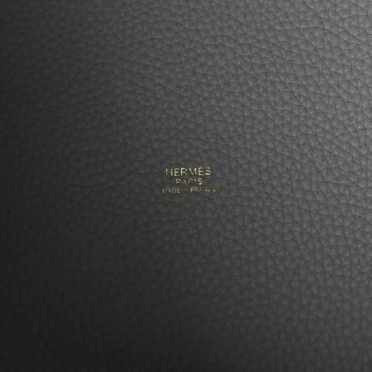 Hermès Paris stamped on dark grey leather panel