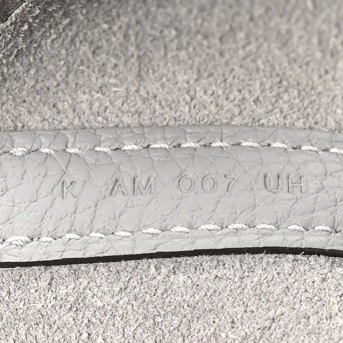 Light grey leather serial stamp on stitched edge