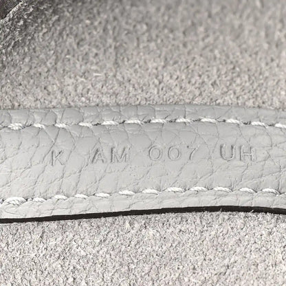 Light grey leather serial stamp on stitched edge