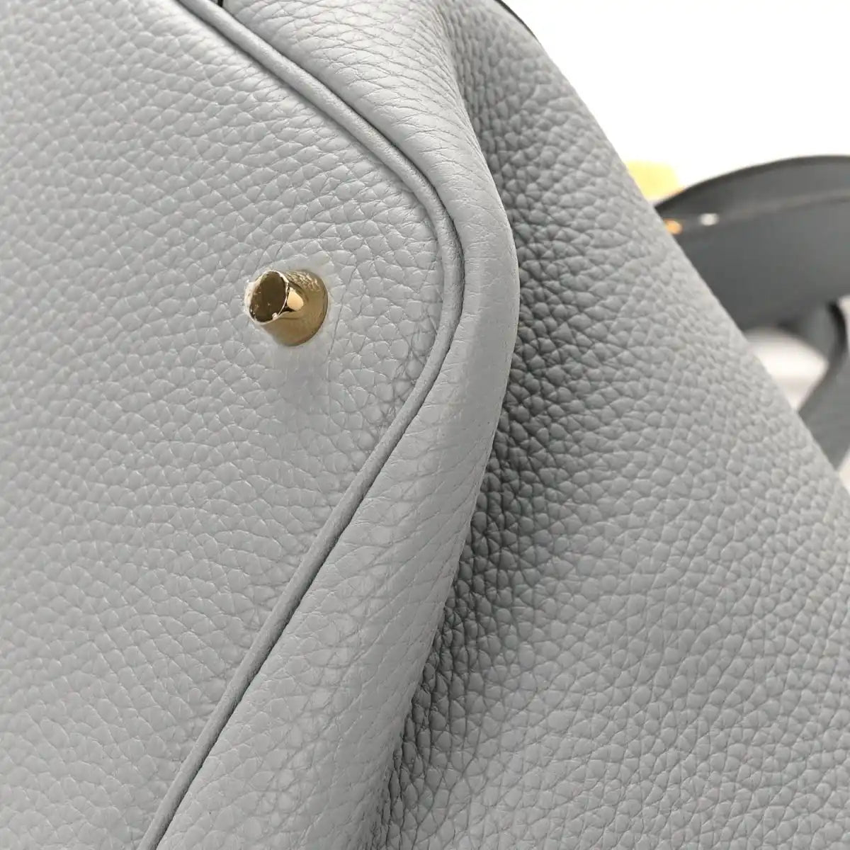 Light gray pebbled leather Picotin lock bag, gold clasp with curved flap seam