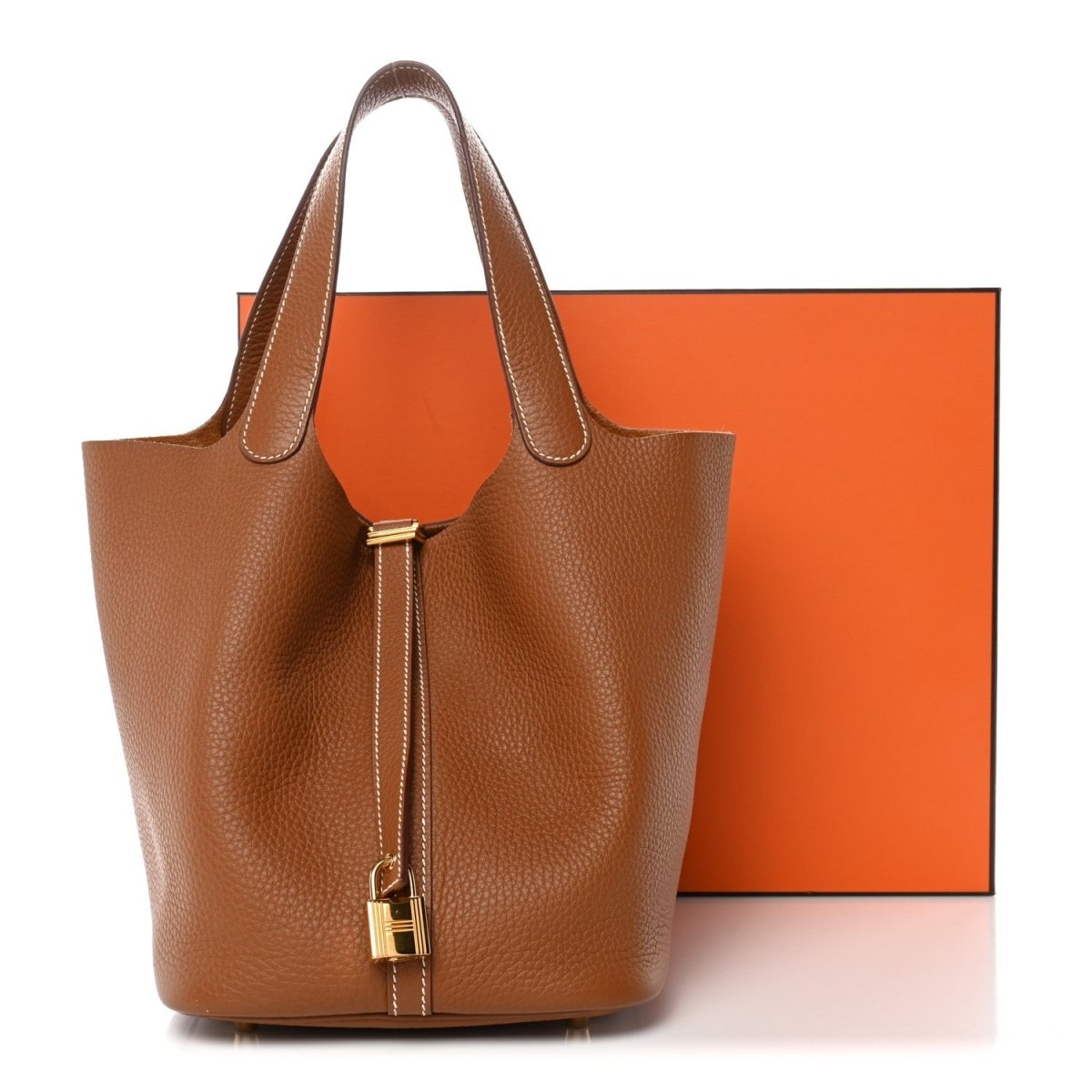 Leather bucket bag with gold lock and tan handles
